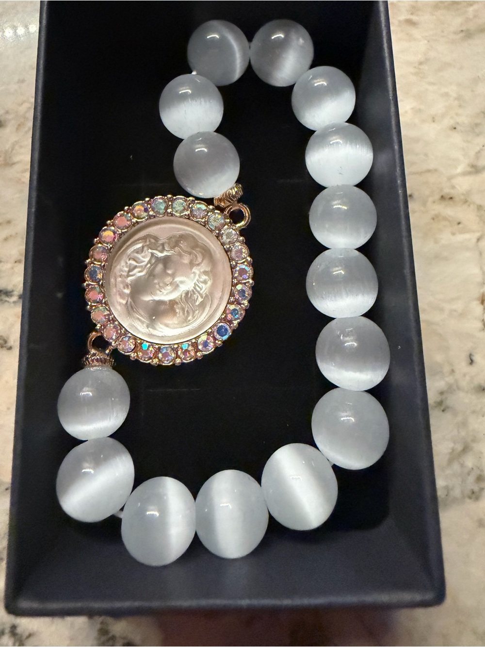 Kirks Folly White Cat's Eye Bead Bracelet with Aurora Rhinestone Cameo